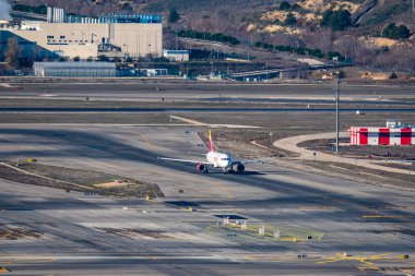 Iberia airline aircraft in the runways of Adolfo Suarez Madrid-Barajas airport ready to take-off clipart