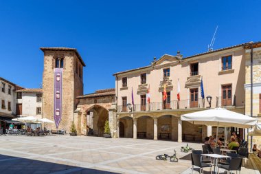 Ona, Spain - 5 August, 2020: City Hall square with restaurants and terraces, sunny day during summer
