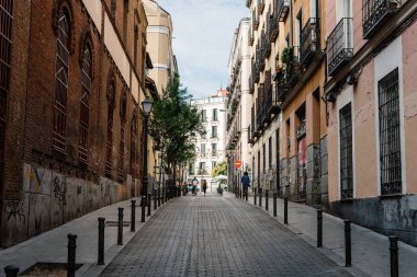 Madrid, Spain - June 5, 2022: Malasana quarter in central Madrid. It is a vibrant neighborhood and a center for the hipster phenomenon, full of lively bars and clubs overflowing with young people. Its