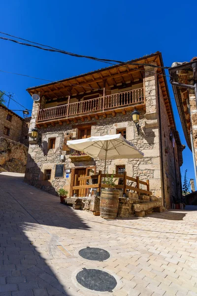 Orbaneja del Castillo, Spain - 5 August, 2020: Scenic view of the picturesque small village with stone houses