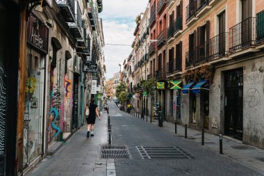 Madrid, Spain - June 5, 2022: Malasana quarter in central Madrid. It is a vibrant neighborhood and a center for the hipster phenomenon, full of lively bars and clubs overflowing with young people. Its