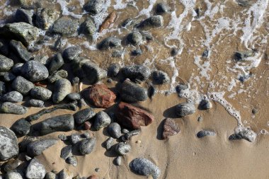 Taşlar ve deniz, deniz sörfü