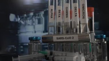 Scientists test for Covid-19 By using science tubes to research and treat illness in a lab or hospital. Medical treatment concepts tubes of Alpha beta gamma delta omicron and sars cov 2