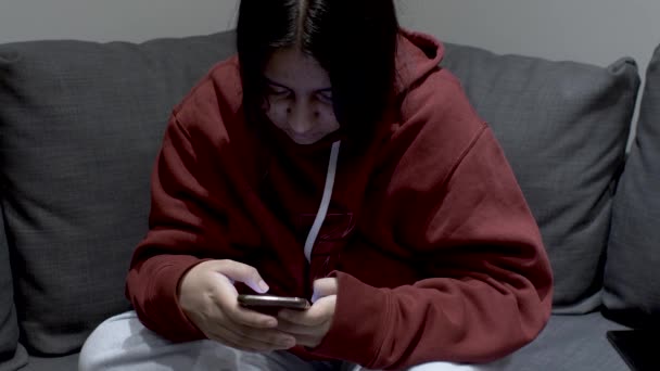 Teenage Youth Dressed Hoody Sitting Sofa Home Young Girl Focused — Stockvideo