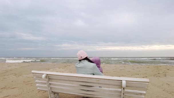 Family spends time together walking near sea in spring time — Stock Video