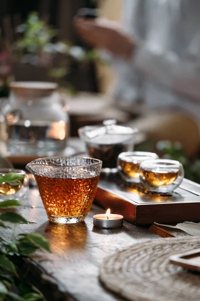 Beautiful chinese tea in teacup with candle flame decoration