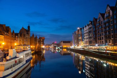Scenic summer evening panorama of the architectural embankment pier canal river illumination of the Old Town GDANSK, POLAND