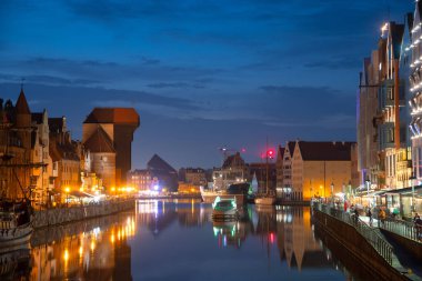Scenic summer evening panorama of the architectural embankment pier canal river illumination of the Old Town GDANSK, POLAND