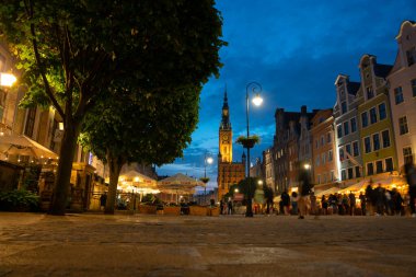 Scenic summer evening panorama of the architectural evening street of the Old Town GDANSK, POLAND - July 6, 2022