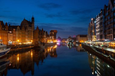 Scenic summer evening panorama of the architectural embankment pier canal river illumination of the Old Town GDANSK, POLAND