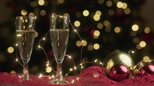 Champagne Glasses Christmas Lights Background Footage — Stock Video