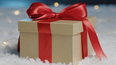 Little gift brown box with red bow