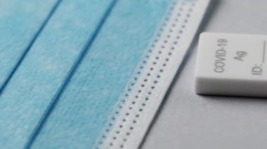 Hand of boy making covid 19 homemade swab test