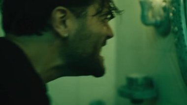 Mad boy in the bathroom at home screams