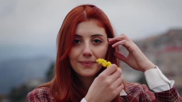 Young girl celebrates womens day with yellow mimosa flowers in hand — Stock Video