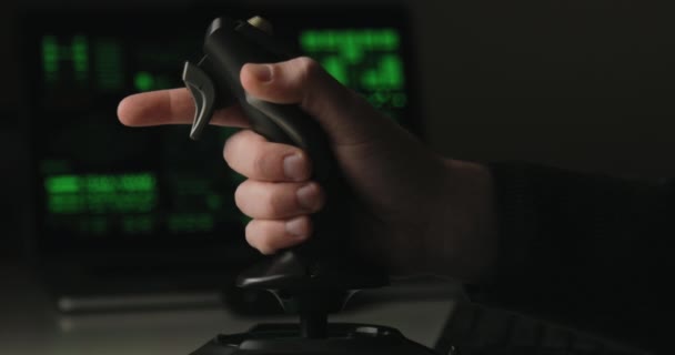 Hand of a military pilot controls a remote spy surveillance drone for warfare — Stock Video