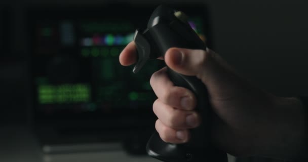 Hand of a military pilot controls a remote spy surveillance drone for warfare — Stock Video
