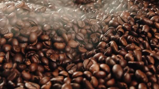 Industrial Coffe beans roasting process with smoke coming out from beans — Stock Video