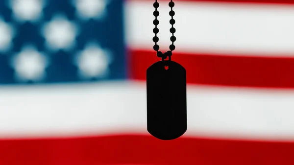 Military tag with the flag of the united states of american out of focus royaltyfrie gratis stockfoto