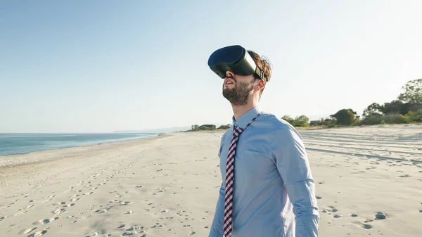Business Man Shirt Wears Virtual Reality Glasses Beach Handheld Shoot – stockfoto