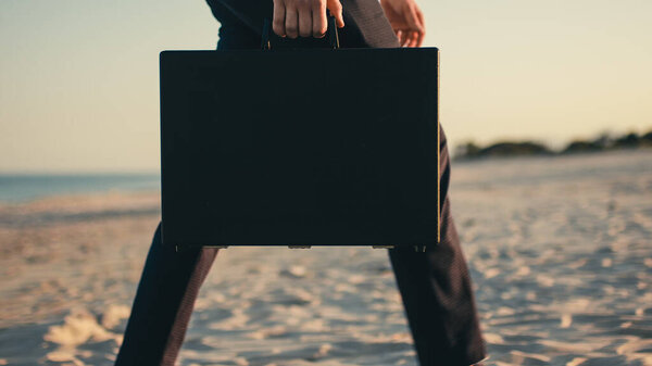 Businessman Black Briefcase Walks Beach Sea Handheld Shoot Stock Picture