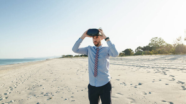 Business Man Shirt Wears Virtual Reality Glasses Beach Handheld Shoot Stock Photo