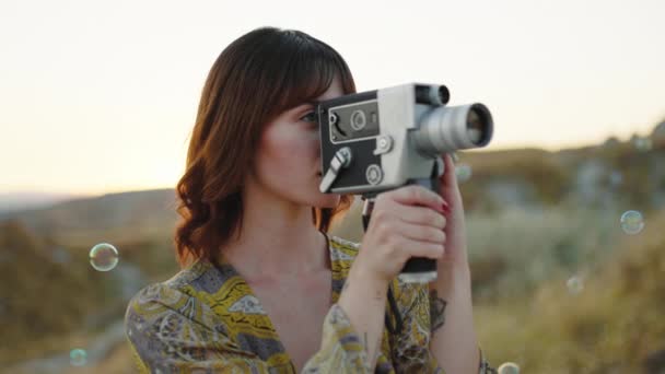 Girl Does Video Shooting Countryside Soap Bubbles — Vídeo de Stock