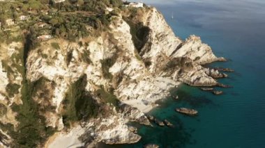 Cliff of Calabria land near the mediterranean sea in summer season. Aerial drone shoot.