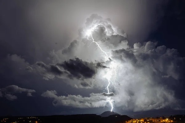 Lightning storm in the clouds in the night sky. Static shoot
