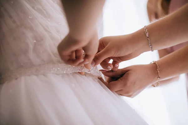 Bridesmaid Helping Bride Dressing Bedroom Royalty Free Stock Images