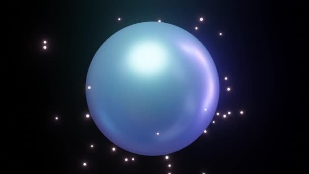 Abstract toy - a metal ball emits colored light particles, from a rectangular pad another ball is formed, which envelops the original ball and it looks like a big pearl. The pad is unpacked again and — 图库视频影像