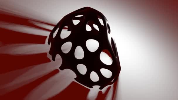 Αφηρημένο ακανόνιστο σφαιρικό αντικείμενο με τρύπες περιστρέφεται στο φως, δημιουργώντας εφέ φωτισμού. Μεταλλικός σχεδιασμός σε σκούρο κόκκινο φόντο. Γραφικά σουρεαλιστικής κίνησης επιστημονικής φαντασίας — Αρχείο Βίντεο