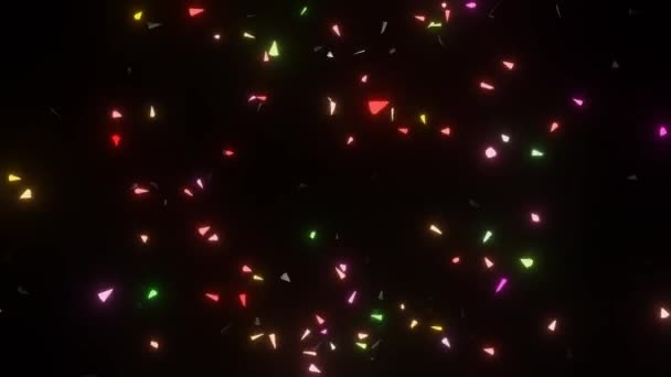 Os fragmentos brilhantes coloridos explodem em um fundo preto, flutuam no espaço por um tempo e lentamente saem. Fogo de artifício-como o efeito com partículas coloridas — Vídeo de Stock