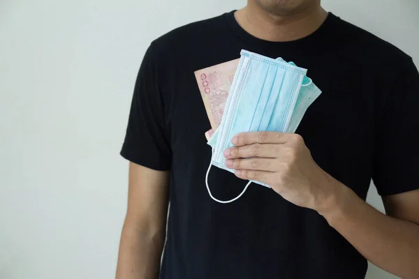 Man Hand Holding Medical Protective Mask Cash Thai Bath Concept — Stock Photo, Image