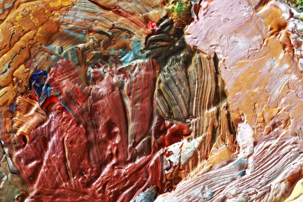 Tuval üzerine yağlı boya boya. Sanat eserinin bir parçası yakından çekildi. Çağdaş sanat. Renkli bir arka plan. Kaotik çok renkli felçler. Gerçek fırça darbeleri.
