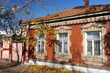 Kolomna, Russia - OCTOBER 9, 2021: an old wooden house with decorative trim on the windows in Kolomna