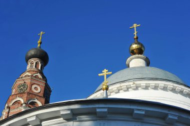 Bronnitsy, Russia - October 9, 2021: golden Orthodox crosses on the domes of the Archangel Cathedral in Bronnitsy
