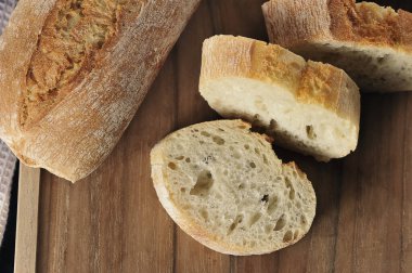 mini baguettes on a black background - French cuisine
