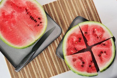 half a watermelon on a plate - red watermelon pulp