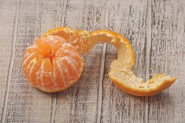 Tangerine Peeled Peel Wooden Background — стоковое фото