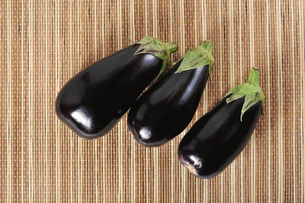 Black Eggplant Reed Background — Zdjęcie stockowe