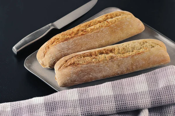Two Mini Baguettes Grey Knife Black Background French Cuisine — Stok fotoğraf