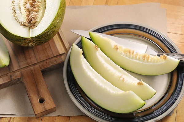 Chopped Melon Melon Slices Knife Craft Paper Background — Stockfoto