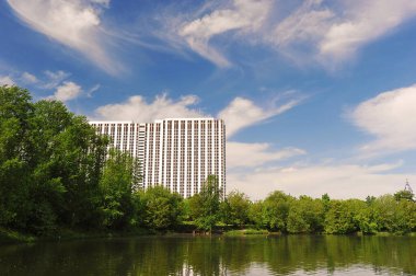 MOSCOW, RUSSIA - May 23, 2021: view of the Gamma Hotel and Serebryano-Vinogradny pond in Moscow