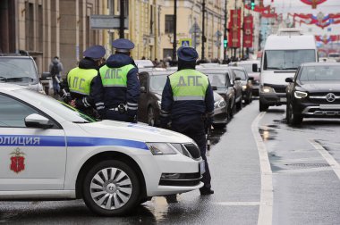 SAINT PETERSBURG, RUSSIA-MAY 7, 2021: Traffic police block traffic on Nevsky Prospekt in Saint Petersburg