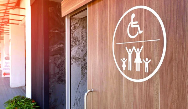 White Disabled Wheelchair Family Restroom Sign Wooden Sliding Bathroom Door — Zdjęcie stockowe