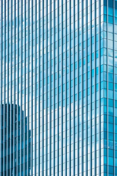 Background abstract line pattern on glass wall surface of skyscraper in perspective view and vertical frame