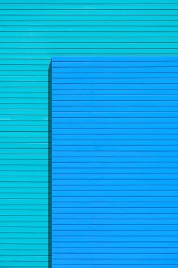 Boş mavi tahta, akıllı tahta dış duvar. İki farklı seviyede dekorasyonu var. fiber çimento tahta dokusu dikey çerçevede