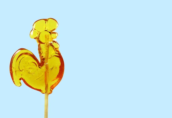 Çubuğun üzerinde şeker horozu (lolipop), Altın şeker karamel                               