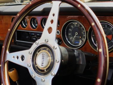 Odometer set in the dashboard of a 1960's Ford Cortina car at a classic car show.